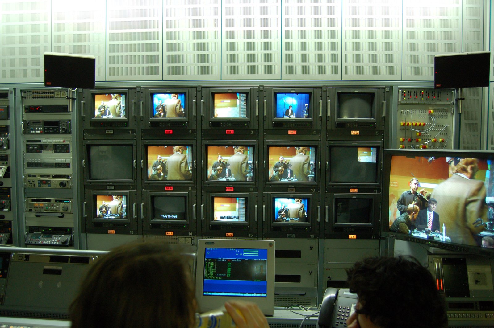 The video mixing desk — a wall of monitors showing the live signals